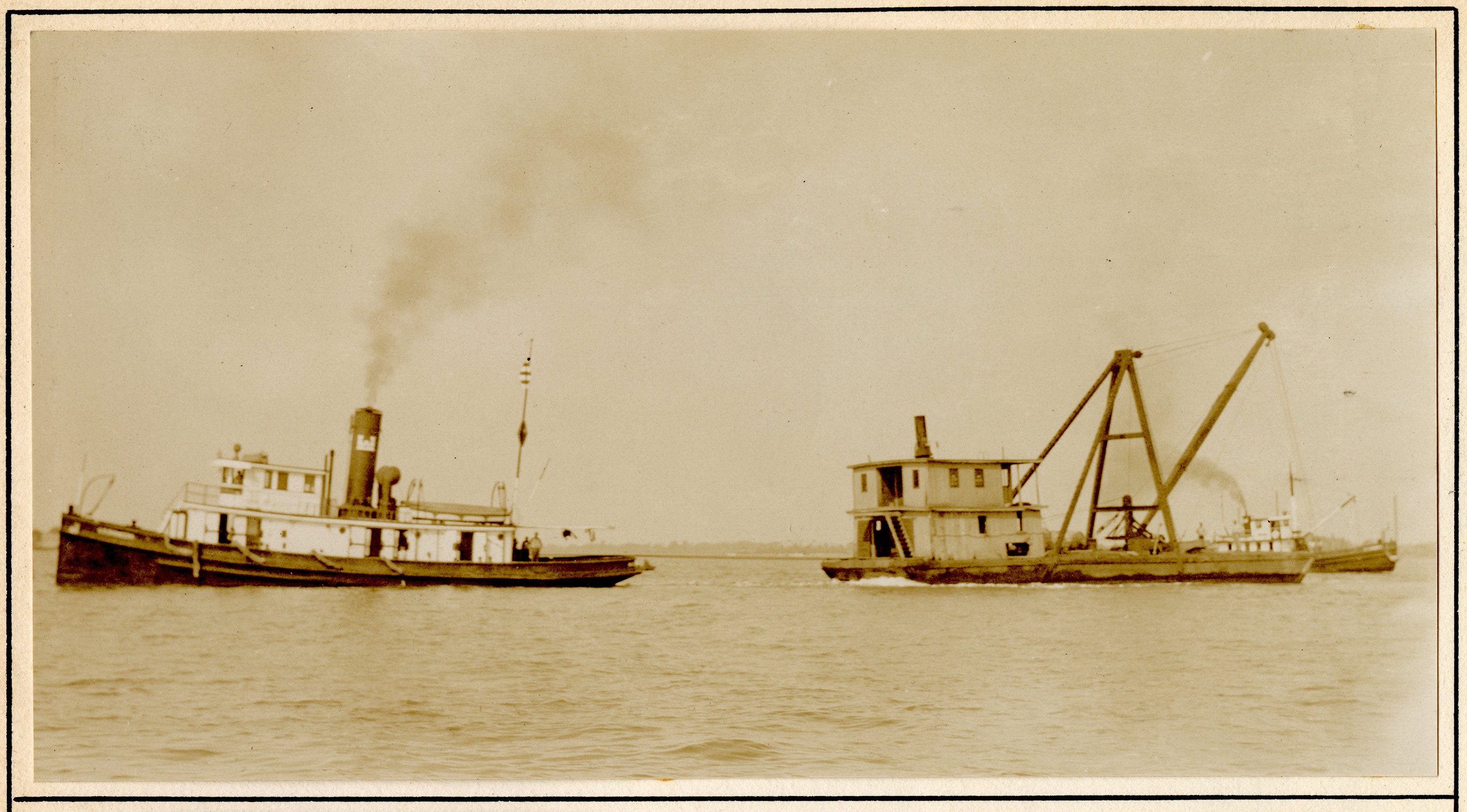 Two small ships in open water